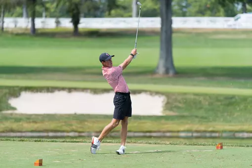 Warren Thomis hitting golf ball