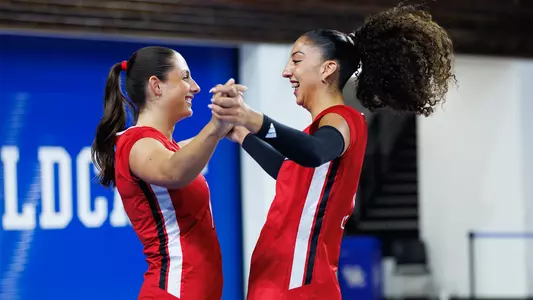 Nayelis Cabello and Chloe Chicoine celebrate at spring match vs Kentucky