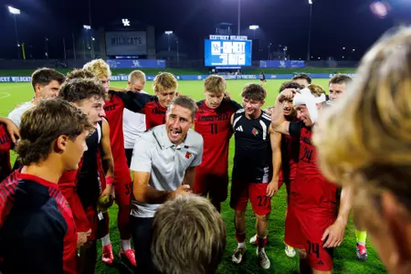 John Michael Hayden encourages the team in a huddle after the game against Kentucky at the Wendell & Vickie Bell Soccer Complex on August 24th, 2026.