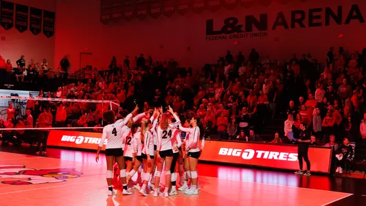 Volleyball huddle wide shot at L&N Federal Credit Union Arena