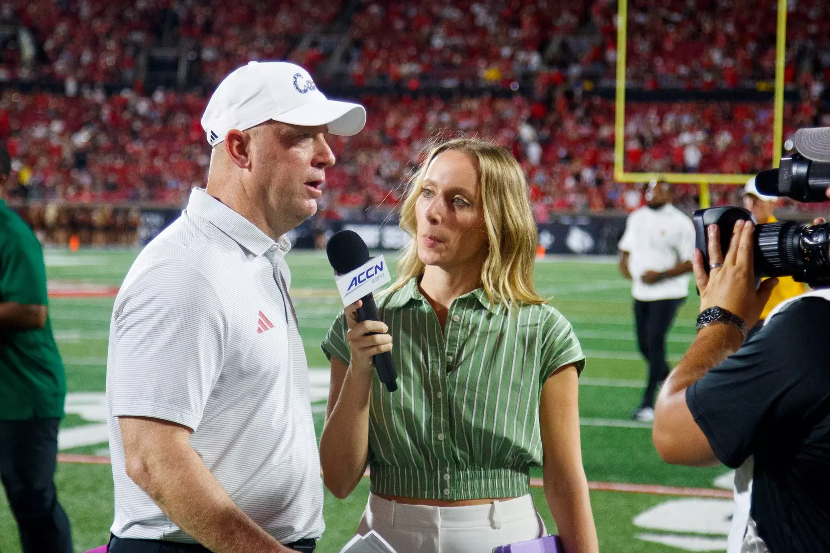 Jeff Brohm being interviewed during the game against Villanova at L&N Stadium on September 11.