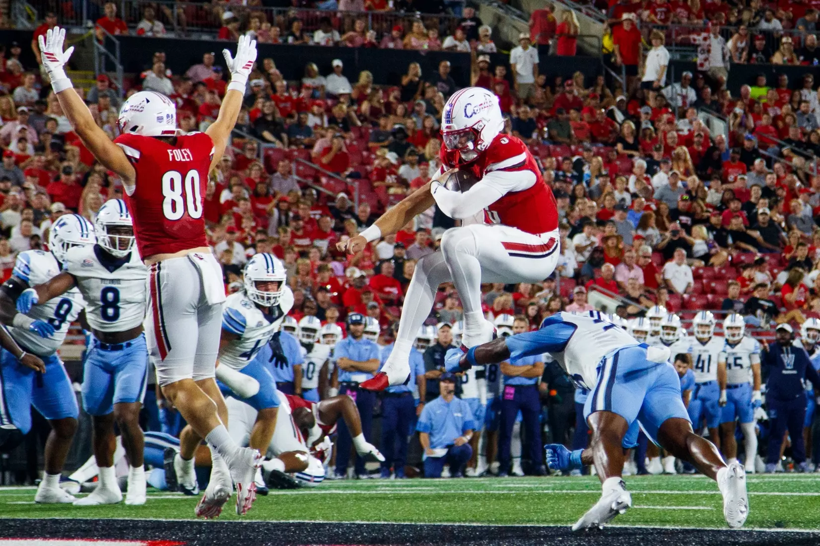 Lincoln Kienholz hurdling a player for a touchdown during the game against Villanova at L&N Stadium on September 11.