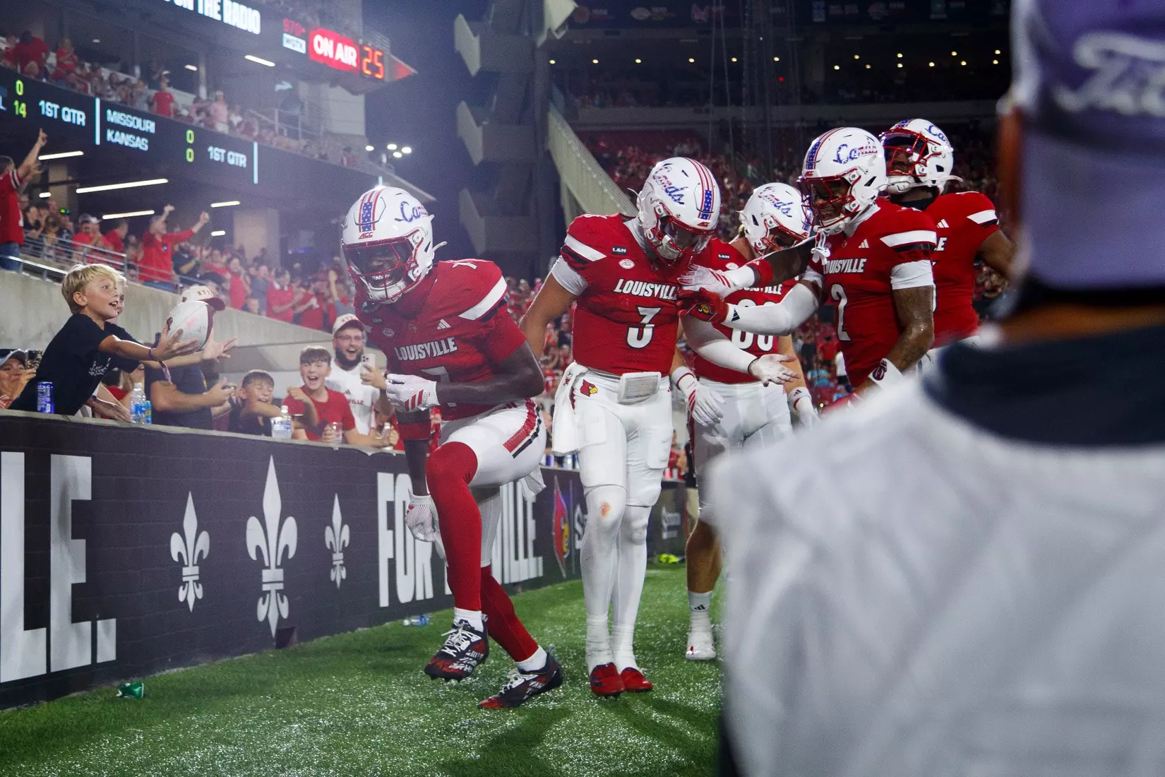 The Cardinals celebrating a touchdown during the game against Villanova at L&N Stadium on September 11.