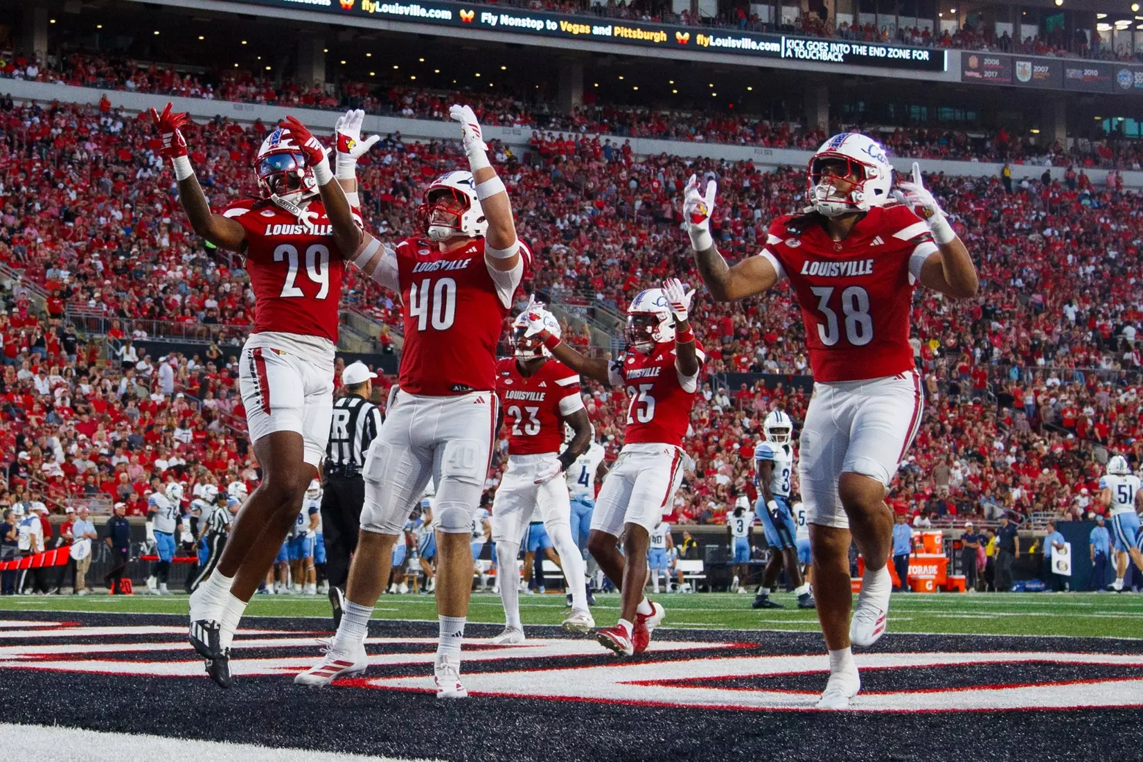 The Cardinals celebrating during the game against Villanova at L&N Stadium on September 11.