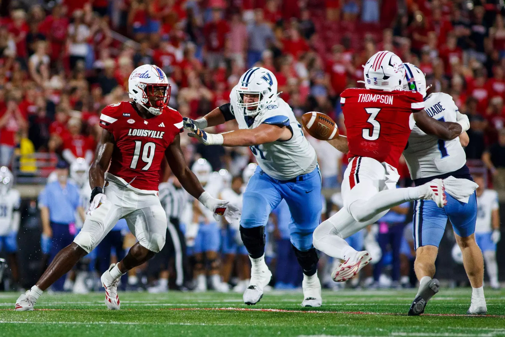 Tyler Thompson forcing a sacking the quarterback for a fumble during the game against Villanova at L&N Stadium on September 11.