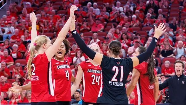 Louisville celebrates a point against Missouri