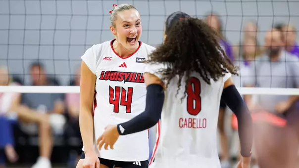 Brooke Bultema and Nayelis Cabello celebrate a point against TCU