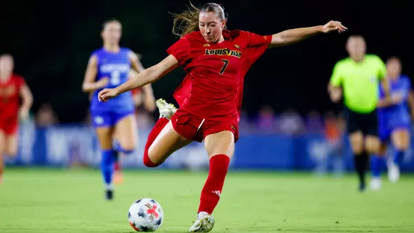 Nicole Jodoin kicking ball