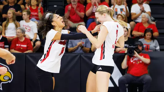 Nayelis Cabello and Chloe Meester celebrate a point during Louisville's win over TCU