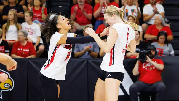 Nayelis Cabello and Chloe Meester celebrate a point during Louisville's win over TCU