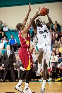 Chanticleers center El Hadji Ndieguene drives around Winthrop Eagles forward Joab Jerome in the first half.