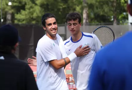 Philippe Tsangarides congratulates Jordi Vives after the match.