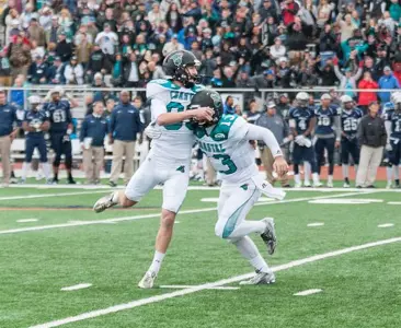 Ryan Granger and Tyler Keane celebrate after CCU's win at Monmouth.