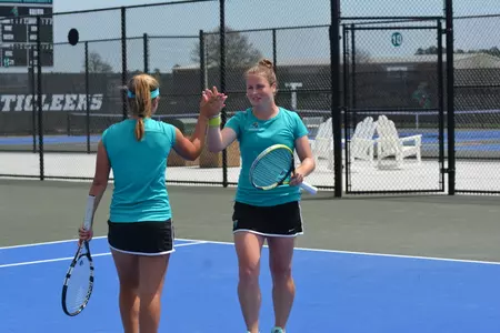 Libby Scott and Marie Babayan celebrate during a recent doubles match.