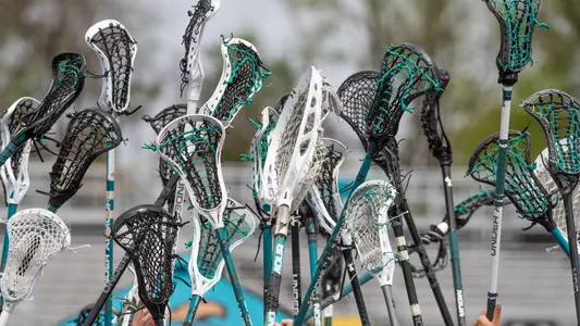 Lacrosse sticks in air