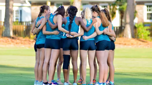 Women's Cross Country pre-race huddle