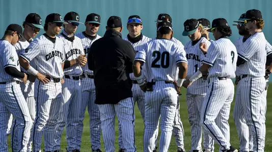 Team pregame huddle on field