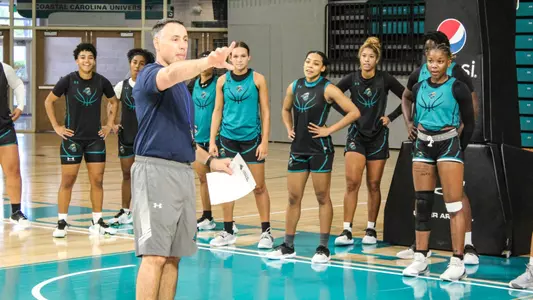 Pederson directing team at practice