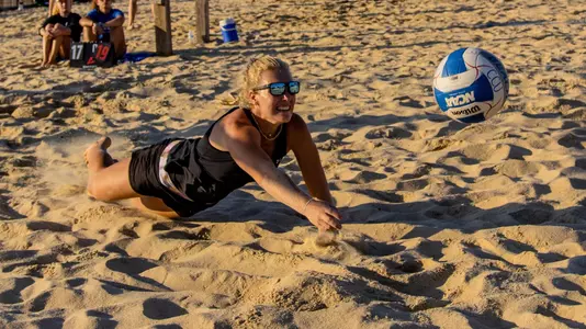 Beach volleyball action in fall event