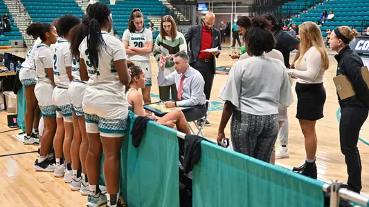 Coach talking to team at timeout