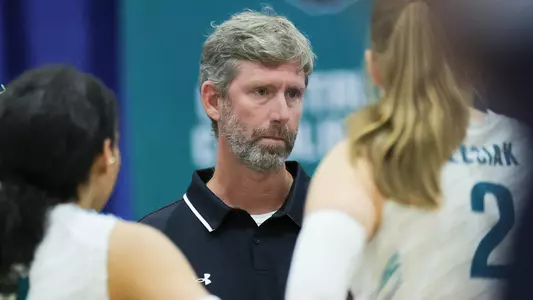 Loeswick talking to team at a timeout