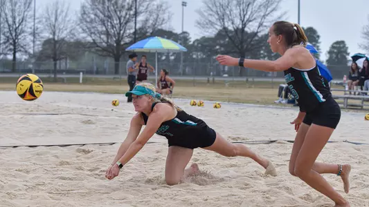 Allred diving for the ball with Ehlers looking on
