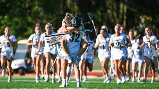 Jumping in the arms of the Goalie