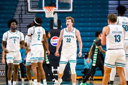 Coastal players celebrate play versus USC Upstate (11/30/2024)