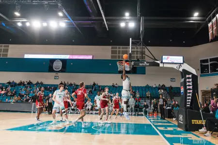 Andre Mulibea goes up for layup against Southern Virginia on 12/11/2024