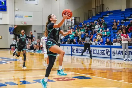Kristin Williams lays up ball against PC on 12/15/2024