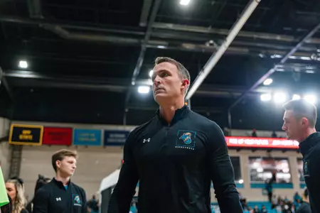 Ryne Lightfoot coaches against Southern Virginia on 12/11/2024