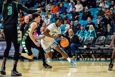 Naz Brown drives ball against Marshall on 1/18/2025