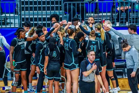Team huddles against GSU on 1/22/2025