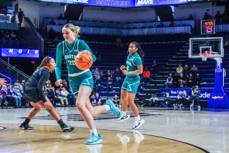 Riley Stack drives against JMU on 1/26/2025