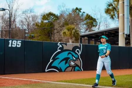 Kate Ryan walks in to dugout from outfield before game against Creighton on 2/7/2025