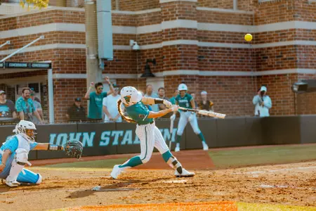 Lucy Goodwin hits ball against Creighton on 2/27/2025