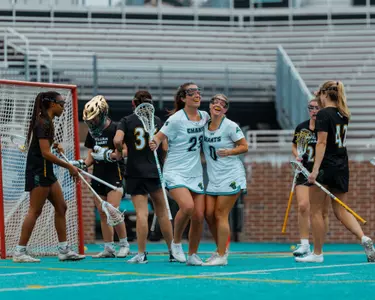 Brigid Cardillo and Sydney McClure celebrate goal against William & Mary on 2/8/2025