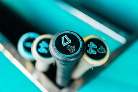Baseball bats sitting in dugout