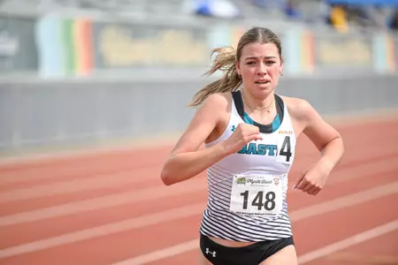 Erin Mcquitty runs in a distance event at the Alan Connie Shamrock Invitational at Myrtle Beach High School on March 16, 2024. Photo by Scott Dean