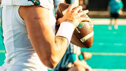 Quarterback throws ball during spring game