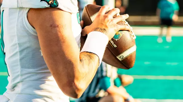 Quarterback throws ball during spring game