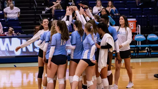 Volleyball Team Huddle Post Fordham win