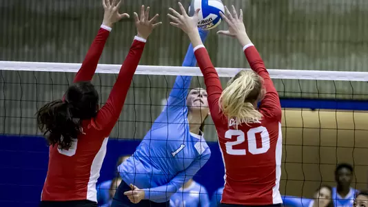 Luciana Del Valle hitting between Cornell block