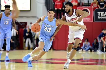 Tai Bibbs #33 of the Columbia Lions is defended by LJ Figueroa #30 of the St. John's Red Storm during a men's basketball game at Carnesecca Arena in Queens, New York on Wednesday, Nov 20, 2019. NCAA Basketball between the Columbia Lions and the St. John's Red Storm.