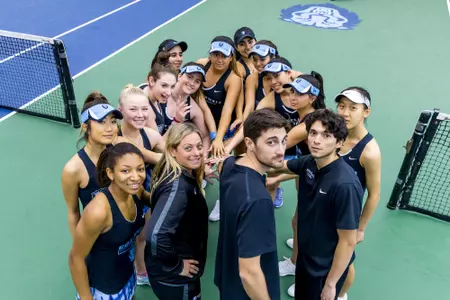 Team Smiling at Camera