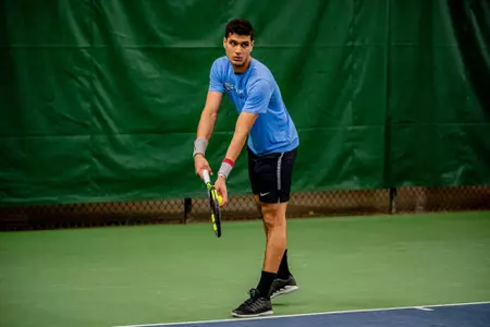 Rian Pandole competing against No. 3 Florida on Feb. 14, 2020