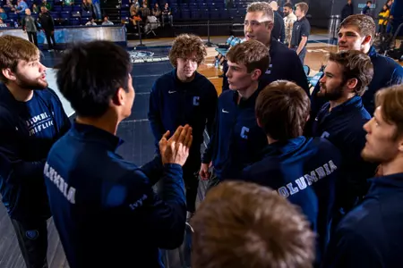 Wrestlers prepare for the start of the dual match