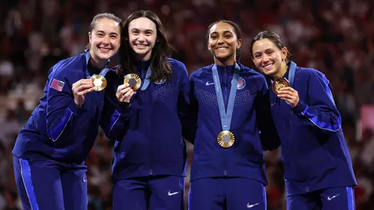 Gold medalists of Team Usa celenbrate on the podium during the Women's Foil Team medal ceremony on day six of the Olympic Games Paris 2024 at Grand Palais on August 01, 2024 in Paris, France. (Photo by Clive Brunskill/Getty Images)