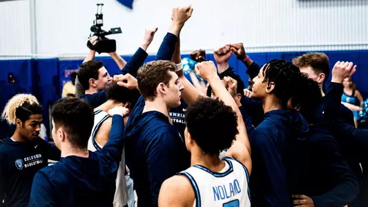 Men's Basketball huddle