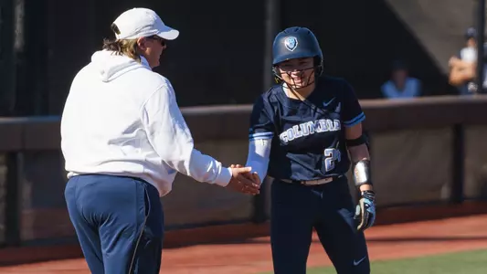 Sarah Mikami celebrates with Coach Teague